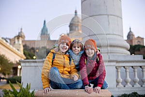 Family, standing in front of national museum in Barcelona, happy family holiday with children