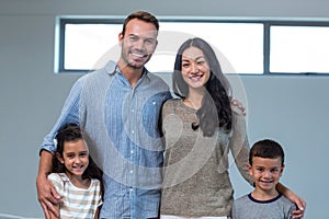 Family standing together and smiling