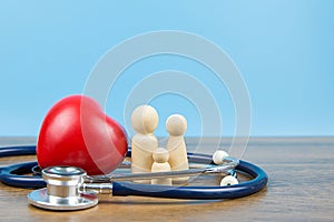 Family with stethoscope and a red heart.