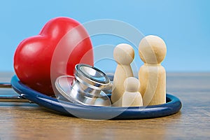 Family with stethoscope and a red heart.