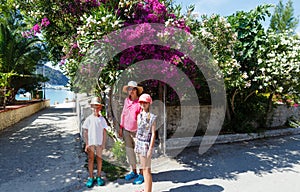 Family on street in Assos village (Greece, Kefalonia)