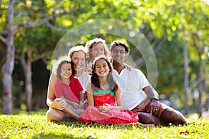 Family in summer park. Parents and kids outdoor