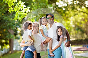 Family in summer park. Parents and kids outdoor