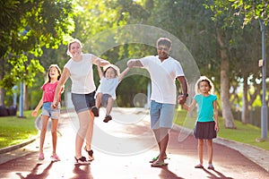 Family in summer park. Parents and kids outdoor