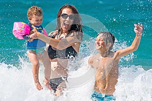 Family summer sea fun water splash