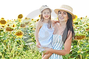 Family Summer vacation traveling in summer.Holidays in village. Freedom concept. Woman in summer field. Mother and baby daughter