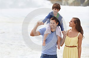 Family, summer and walking outdoor at beach for travel holiday with a smile and fun. A man, woman and child or son on