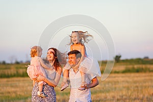 Family at sunset on sloping field  countryside