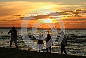 Family sunset stroll photo