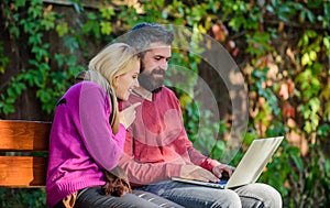 Family surfing internet for interesting content. Couple in love notebook consume content. Internet surfing concept