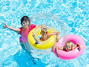 Family in swimming pool.