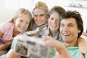 Family taking self portrait with digital camera