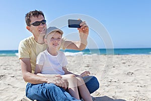 Family taking selfie at the beach