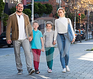 Family taking a walk in town