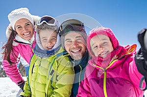 Family taking winter selfie