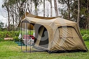 Family tent setup at the campsite surrounding by nature in caravan holiday park