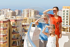 Family of three on the balcony at the hotel