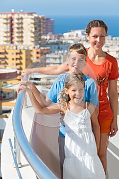 Family of three on the balcony