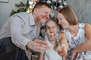 Family of Three Celebrating Christmas at Home