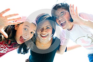 Family of three girls in fun expression