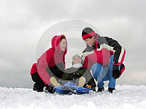 Family of three sit. winter