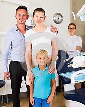 Family of three is visiting dentist