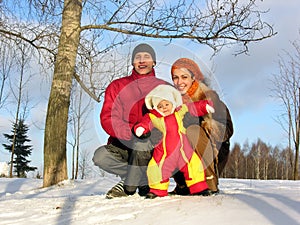 Family of three. winter. sun.