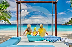 Family with three year old boy on beach. Seychelles, Mahe