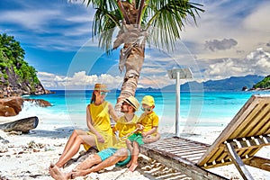 Family with three year old boy on beach. Seychelles, Mahe