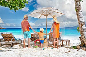 Family with three year old boy on beach. Seychelles, Mahe