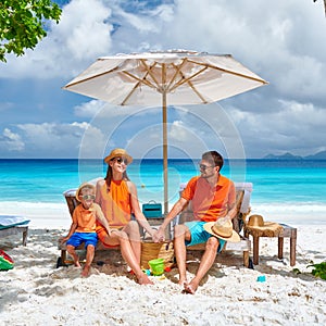 Family with three year old boy on beach. Seychelles, Mahe