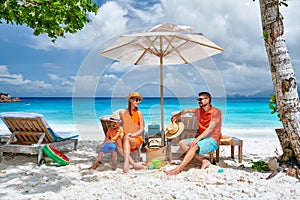 Family with three year old boy on beach. Seychelles, Mahe