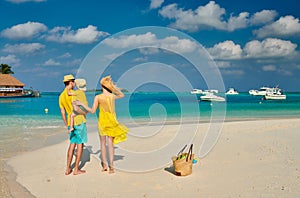 Family with three year old boy on beach