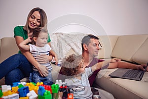 Family time - children and parent playing with blocks toys