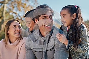 Family time is the greatest investment in life. a happy young enjoying spending time together in the park.