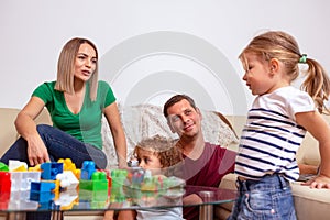 Family time - parent and children playing with blocks toys