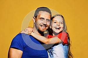 Family time and parenthood concept. Man and girl hug