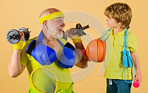 Family time together. Healthy grandfather and Grandson workout. Grandfather and kid sporting.