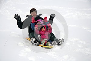 Family tobogganing photo