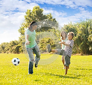 Family together playing with soccer ball