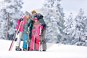Family together skiing on mountain