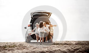 Family travel car road trip concept. summer vacation in car in the sunset, Dad, mom and daughter happy traveling enjoy and