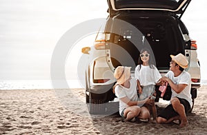 Family travel car road trip concept. summer vacation in car in the sunset, Dad, mom and daughter happy traveling enjoy and