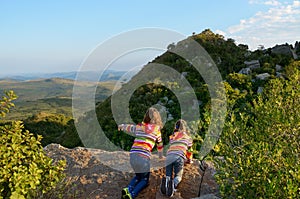 Family travel with children, kids looking from mountain viewpoint, holiday vacation in South Africa