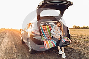 Family and travel concept, Happy family, mom and child enjoying the trip by car