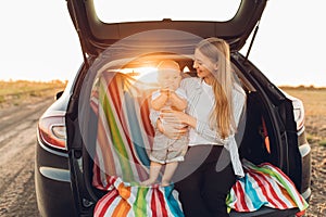 Family and travel concept, Happy family, mom and child enjoying the trip by car