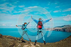 Family travel - happy father and son enjoy hiking in nature