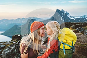 Family travel lifestyle mother hiking with daughter child outdoor active vacations backpacking in mountains