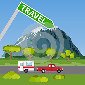 Family traveler truck summer trip concept. A pickup truck with a trailer rides along the road in the mountains and forest