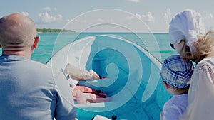 Family traveling by boat on high speed